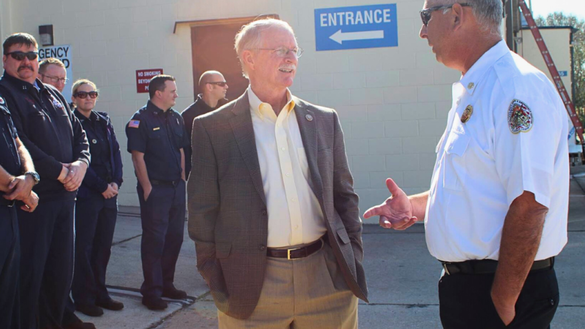 Representative John Rutherford speaking with EMT 