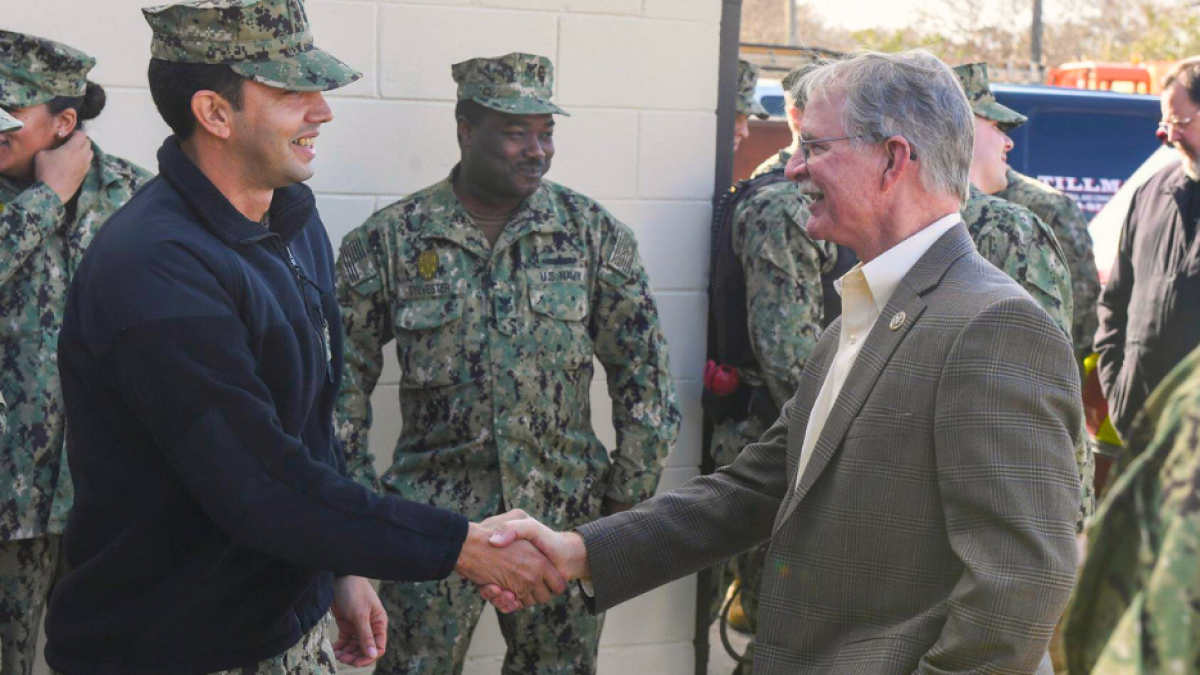 Rep. Rutherford shakes hands with members of the U.S. Navy in Jacksonville, Florida.