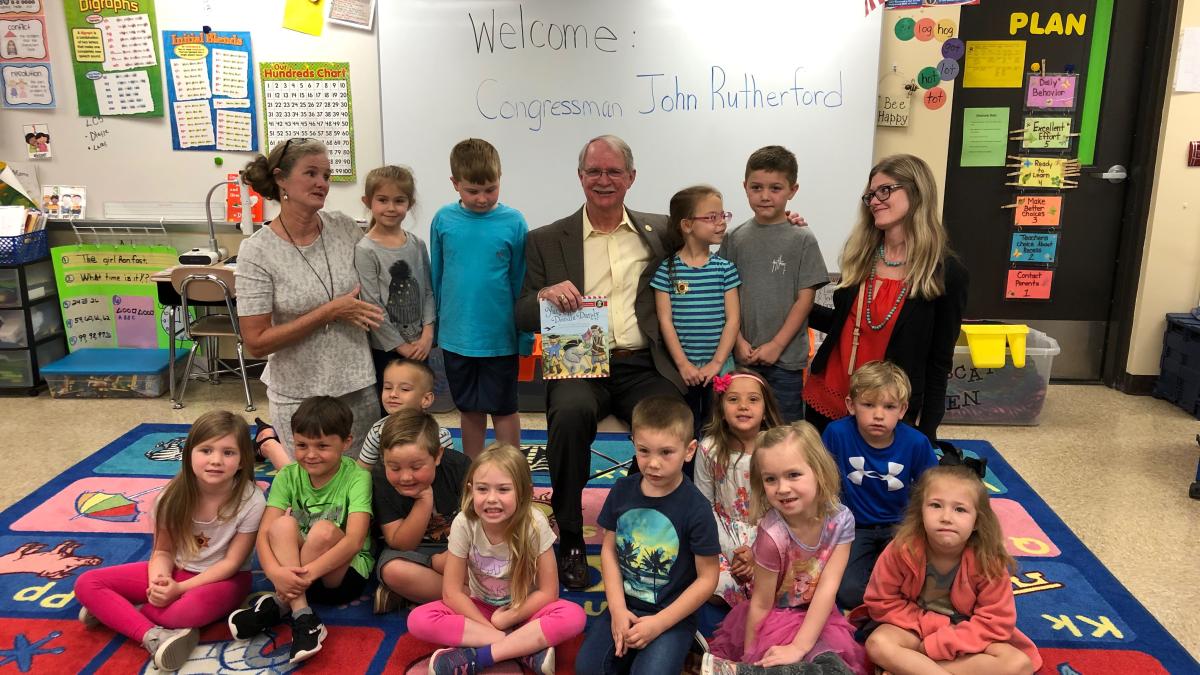 Rutherford reading to students