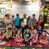 Rutherford reading to students