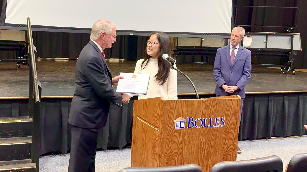 Congressman John Rutherford presenting Sarah Park with the certificate for first place in the Congressional App Challenge Competition.