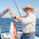 Congressman Rutherford catches a red snapper off the coast of St. Augustine